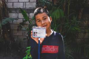 Elias receiving his education card