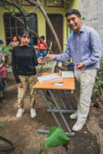 High school student receiving his card
