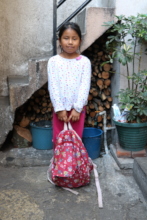 Damariz's 1st year of school, with a big backpack