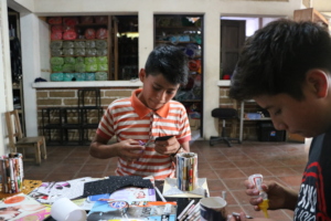 Manuel and David work on their pen holders