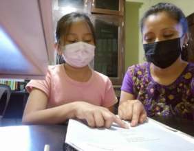 Lidia practicing reading with our social coordinat