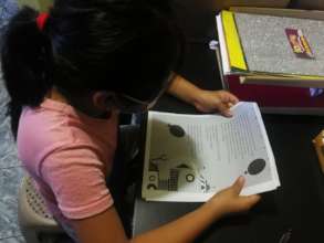 Lidia reading the story "Nino Robot"