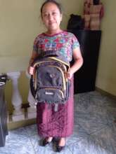 Lourdes happy with her backpack and school supplie