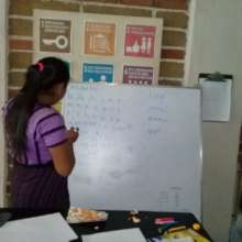 Lourdes revising Tz'utujil, her native language