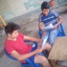 Oliver and Misael reading at home