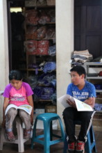 Oliver reads at a Mano a Mano's literacy workshop