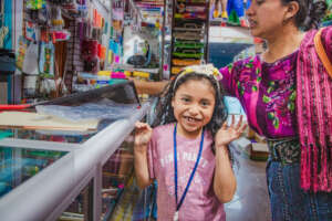 buying school supply in the company of her mother