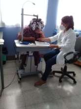 Maria's eyes are being checked.