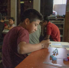 David drawing his favorite games at the town fair