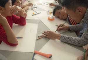 Diego sneaks a smile during our art workshop