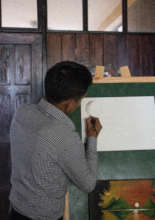 Mano a mano director Jose and a painting he made