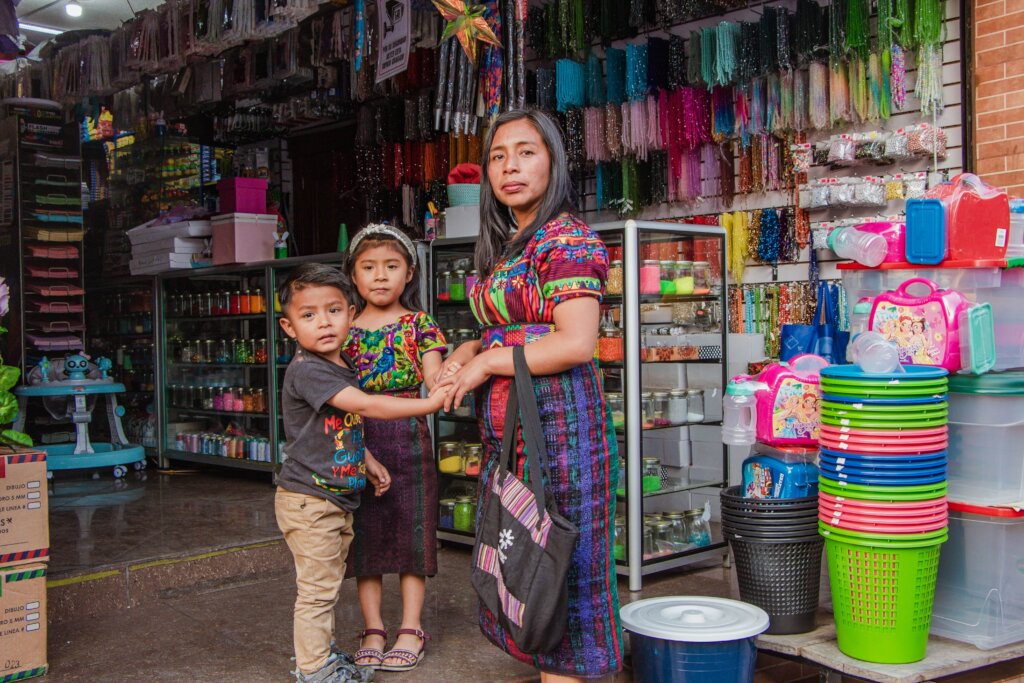 Marta and her children shopping for school