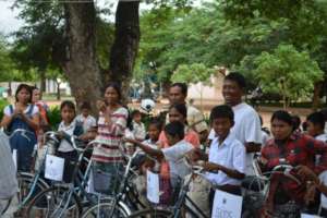 Happy Students And Family Members With New Bikes