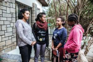 Asnaku supporting the younger girls in the program