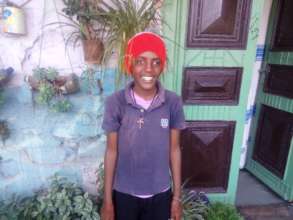 Maraki at home during social worker's visit