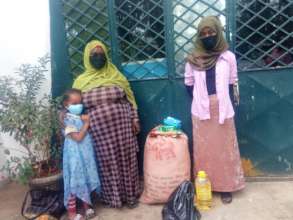 Sofia's family receiving emergency food, pad, soap