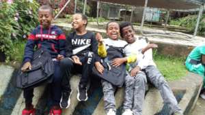 Children excited to receive their new school bags