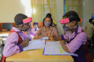 Tigist supporting younger students in tutorials