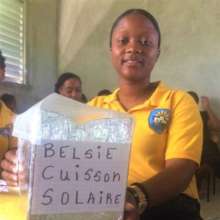 Belsie with her solar cooker homework