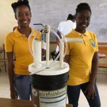 Students with a model biodigester