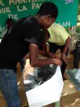 A new solar cooker at university in Hinche, Haiti