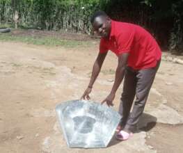 Group member testing his solar cooker - Hinche