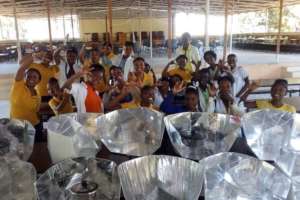 New students learning to assemble solar cookers
