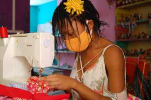 Masked girl makes masks