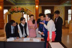 Students debate in Model United Nations format.