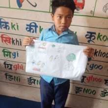 Proudly showing his art work