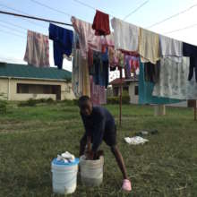 Washing the uniform at Malaika