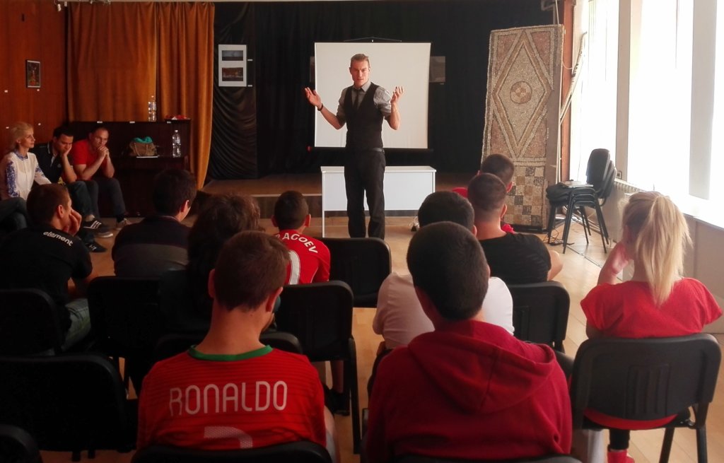 Dimitar, an IT volunteer, with some students