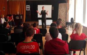 Dimitar, an IT volunteer, with some students