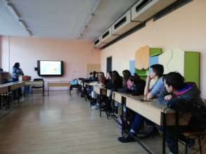 Volunteer presenting her career choice to students