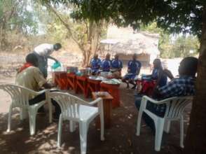 Girls having lunch together with staff