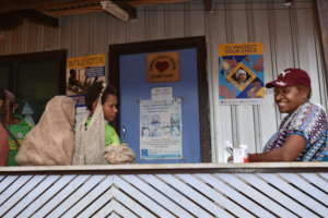 An owlet waits with patients outside the clinic