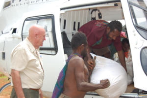 Unloading famine relief supplies from helicopter
