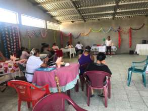 Community Members listen to Projects Presentaitons