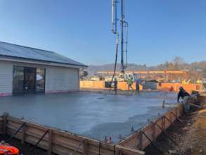 Concrete gets poured for the central building