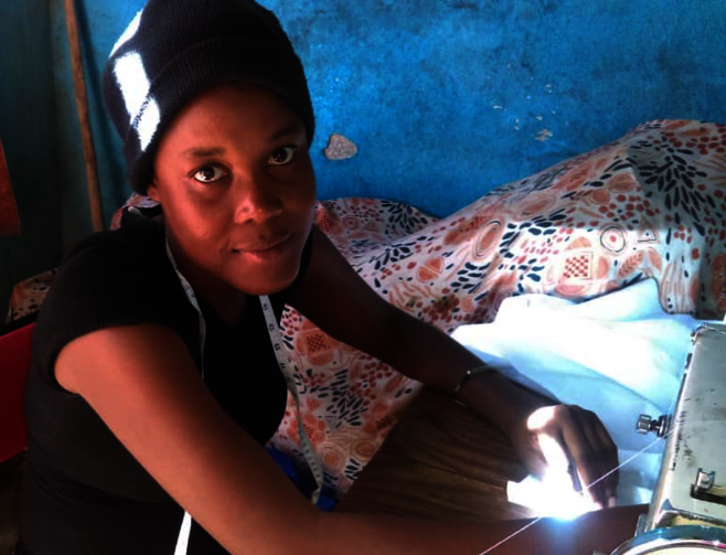Myrlande, a seamstress, makes beekeeping suits