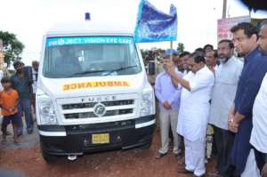 Deputy CM Dr. G Parameshhwara flagging  ambulance