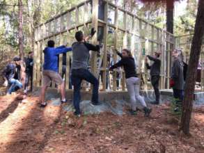 Volunteers raising the new Barred owl cage