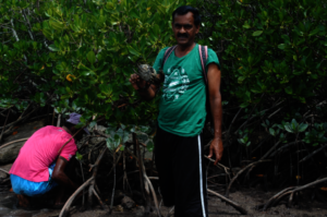 A local showing the crab he caught