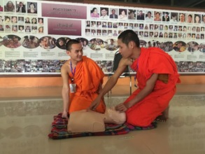 Class Leader Assists Classmate in CPR Instruction