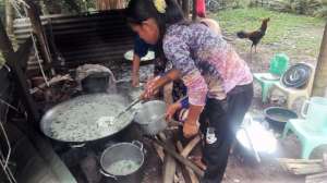 School Moms cooking rice soup with clean water