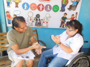 Heimy teaching signs to team member