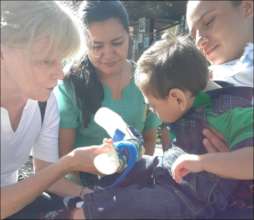 Therapist from the brigad working with child