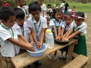 Washing before lunch in makeshift basins