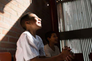 Happy student enjoying sunlight and fresh air