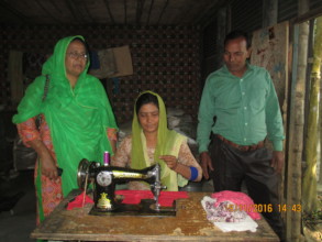 Feruja working with sewing machine at home